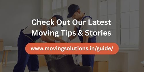 Two movers packing boxes in a living room with overlay text promoting moving tips and stories from movingsolutions.in/guide.