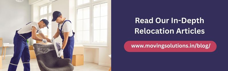 Professional movers wrapping a chair with protective material in a bright room, recommending Moving Solutions relocation blog and articles.