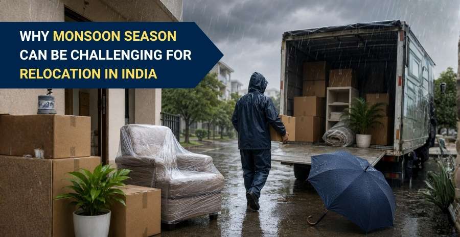 Worker loading household items into a moving truck during the monsoon season in India.